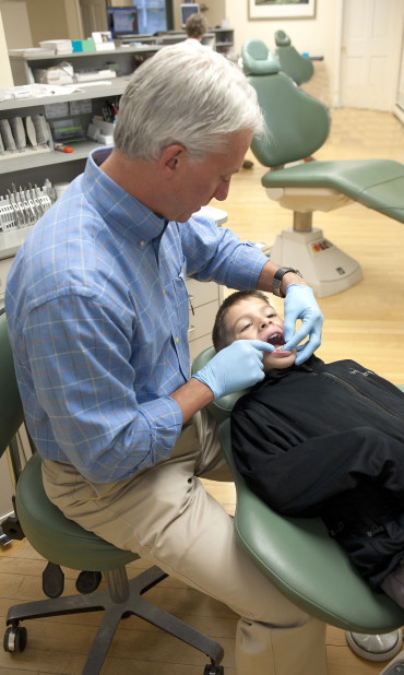 Dr. Price and a young patient